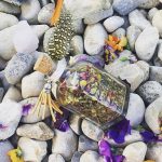Kylie Wells herb tea in a jar on rocks