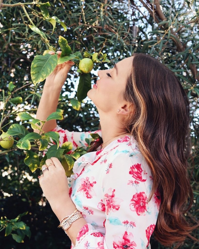 Miranda Kerr in garden with lime tree