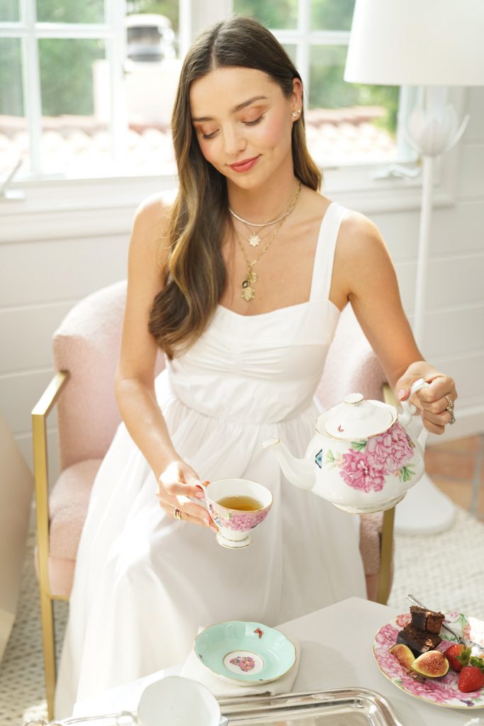 Miranda Kerr pouring tea with Royal Albert tea set