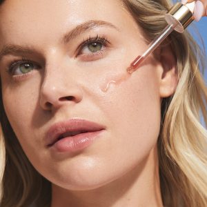 niacinamide serum on model's cheek